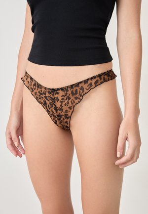 Perizoma trasparente con stampa leopardata in marrone e nero, caratterizzato da un bordo ondulato e un delicato rifinitura. Leggero, con un design a copertura minima.