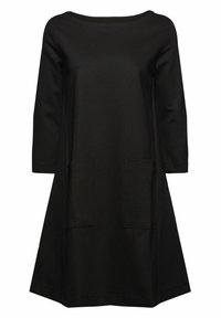 Robe noire à manches longues, coupe A-line, avec encolure bateau et deux poches plaquées devant, longueur genou.