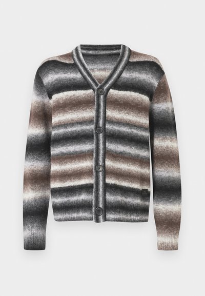 V-kaelusega kardigan, millel on horisontaalsed triibud musta, halli ja pruuni värvusega. Ees kaks nuppu, soonilised varrukasääred ja pehme kootud tekstuur.
