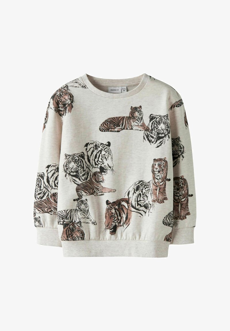 Gaiši pelēka džemperis ar dažādiem tīģera dizainiem brūnos un melnos toņos. Ērts audums ar ribotām aprocēm un apakšmalu.