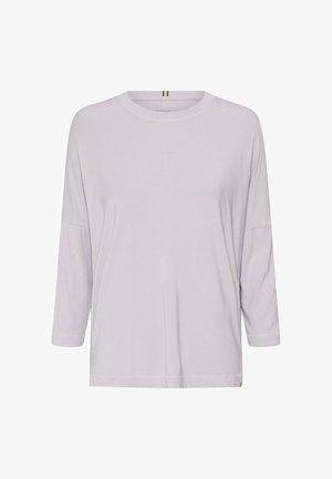 Jasnoszara bluzka z długim rękawem o okrągłym dekolcie, szerokim kroju i miękkim materiale. Zawiera subtelny detal logotypu u dołu oraz luźny krój.