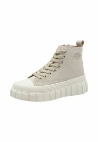 Baskets montantes en cuir beige clair, avec une semelle épaisse blanche à texture nervurée, bout rond et lacets. Accent logo circulaire.