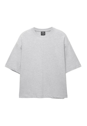 Maglietta oversize grigia chiara in tessuto misto cotone, con scollo rotondo e maniche corte e larghe. Design semplice, senza motivi.