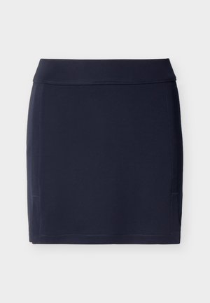 Gonna blu navy scuro a taglio dritto con una fascia larga in vita e sottili cuciture verticali sui lati, distesa su uno sfondo chiaro.