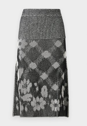 Schwarz-weißer Strickrock mit einem strukturierten gerippten Taillenbund und einem Blumenmuster. Der Hauptstoff weist vertikale Streifen und Akzente auf.