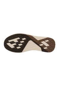 Shoe outsole with a textured pattern. Colors include cream, brown, and black with geometric shapes and a triangular design element.