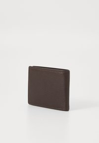Brown leather wallet featuring a textured surface, bi-fold design, and subtle stitching along the edges, shown at an angle.