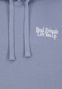 Pullover hoodie in light blue cotton, featuring a front pocket and white embroidered text "Real Friends Lift You Up." Drawstrings are textured.