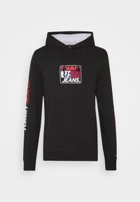 Zwarte hoodie van katoen met een voorvak. Voorzien van een kleurrijk "TOMMY USA JEANS" logo op de borst en tekstdetails op de mouwen.