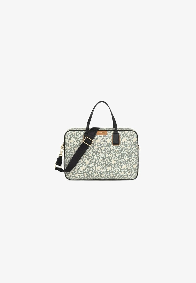 Bolso para portátil con base crema, patrón floral negro, asas negras y correa de hombro desmontable. Detalles en hardware dorado y logotipo.