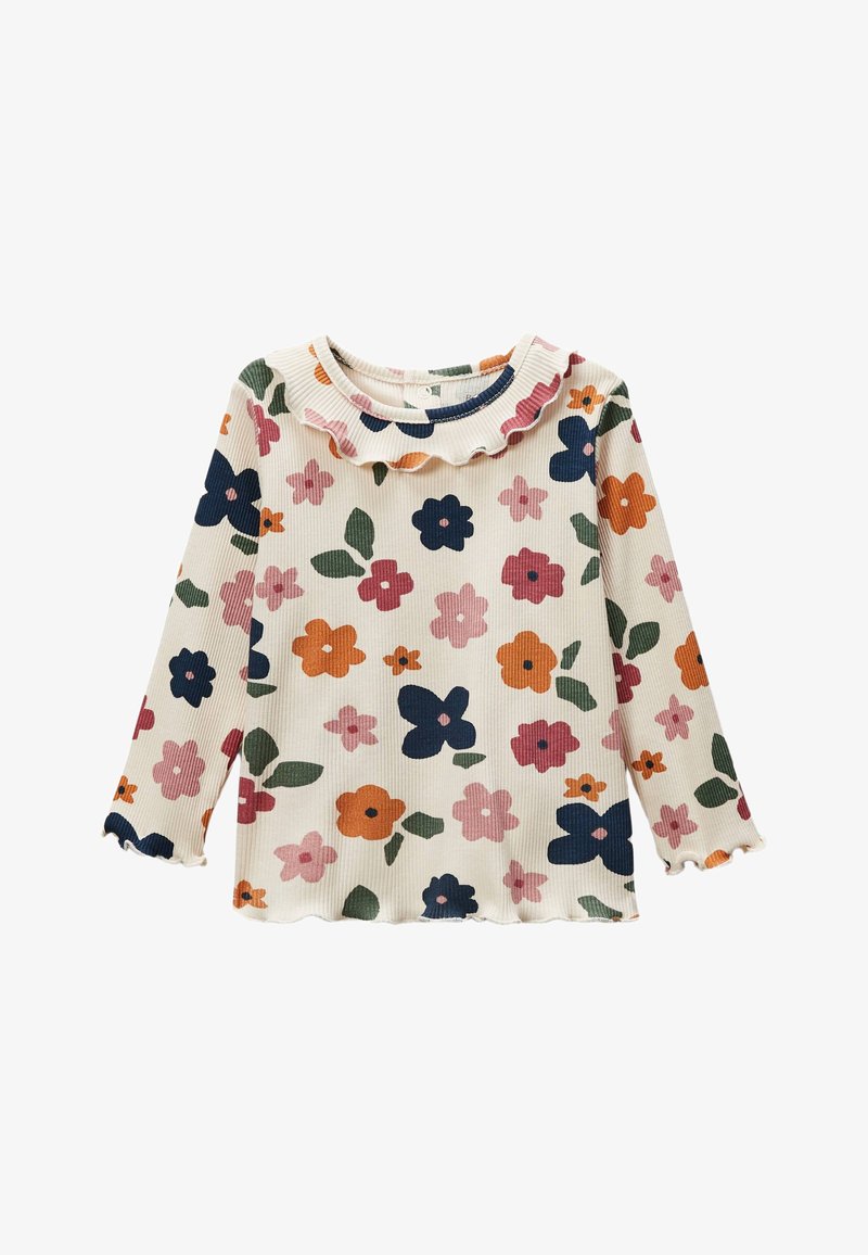 Haut à manches longues en crème avec des motifs floraux multicolores. Encolure arrondie avec une bordure en dentelle. Tissu texturé avec un ourlet festonné.