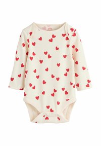 Kreemikas beebibodi soonilise tekstuuriga, millel on hajutatud punased südamekujundid ja allosas presskinnitused. Pikad varrukad.