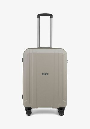 Hard-shell suitcase in light beige, featuring a textured surface, four wheels, a telescopic handle, and an emblem on the front.