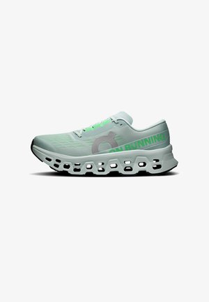 Chaussure de course vert clair avec une grande semelle blanche ventilée et le texte "ON RUNNING" en vert vif sur le côté.