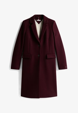 Bordeauxrode wollen mantel met een notched kraag, twee voorzakken, enkele knoopsluiting en lange mouwen. Voering aan de binnenkant.