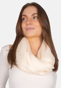 Weiches, leichtes Infinity-Tuch aus transparenter Stoff mit zarter Textur, das sanft um den Hals fällt.