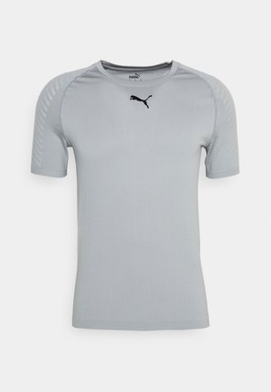 Light gray short-sleeve athletic shirt with a round neckline and black logo. Features textured shoulder panels and smooth fabric.