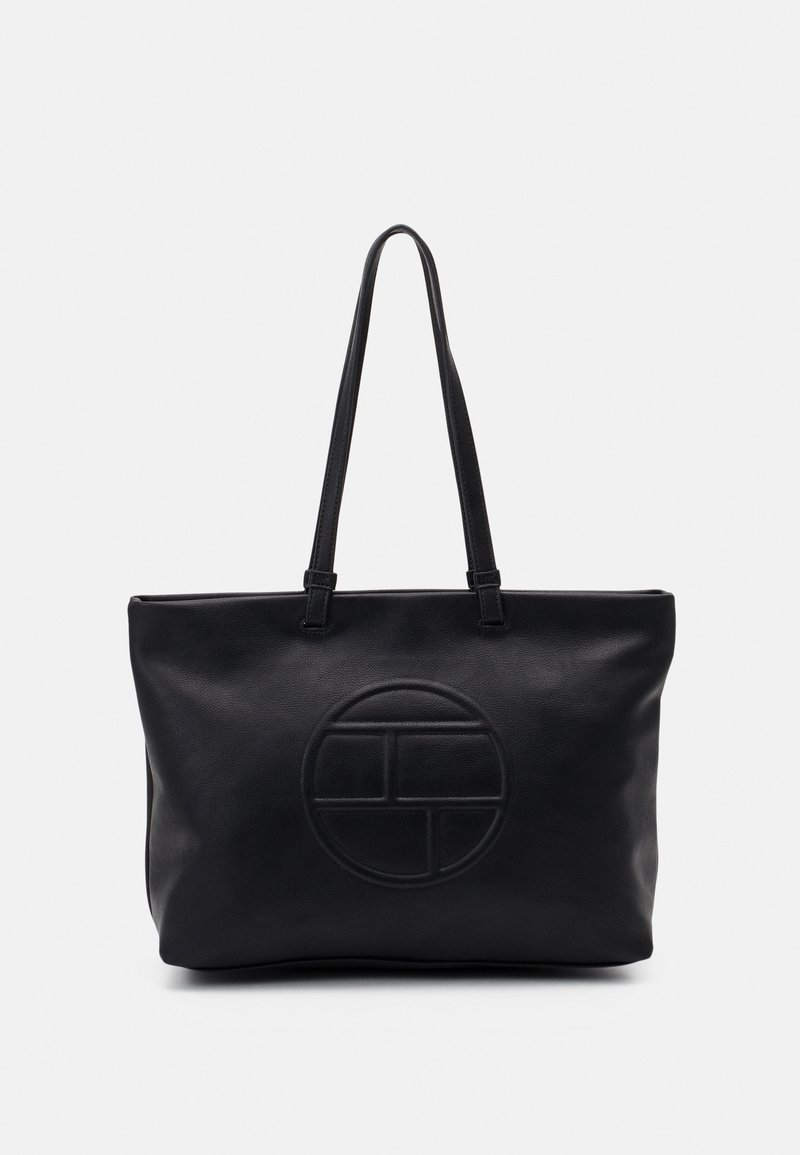 Sac fourre-tout en cuir noir avec de longues anses et un motif géométrique circulaire embossé au centre avant sur un fond uni.