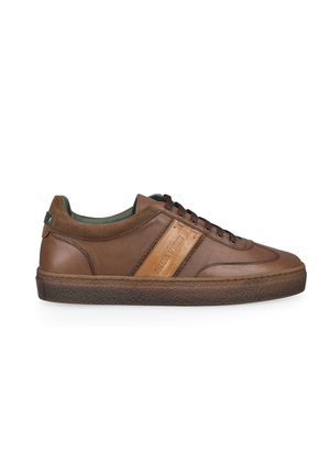 Brown leather low-top sneaker with lace-up front and textured sole, featuring a lighter brown patch with embossed text on the side.