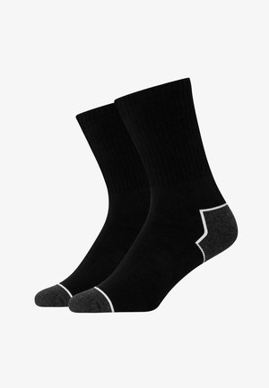 Chaussettes de crew noires avec une texture côtelée, dotées d'un talon et d'une pointe grise avec un bord blanc. Conçues pour le confort et la durabilité.