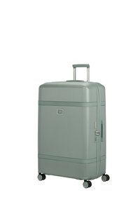 Hard-shell suitcase in matte teal, features a vertical striped texture, retractable handle, and four spinner wheels for easy mobility.