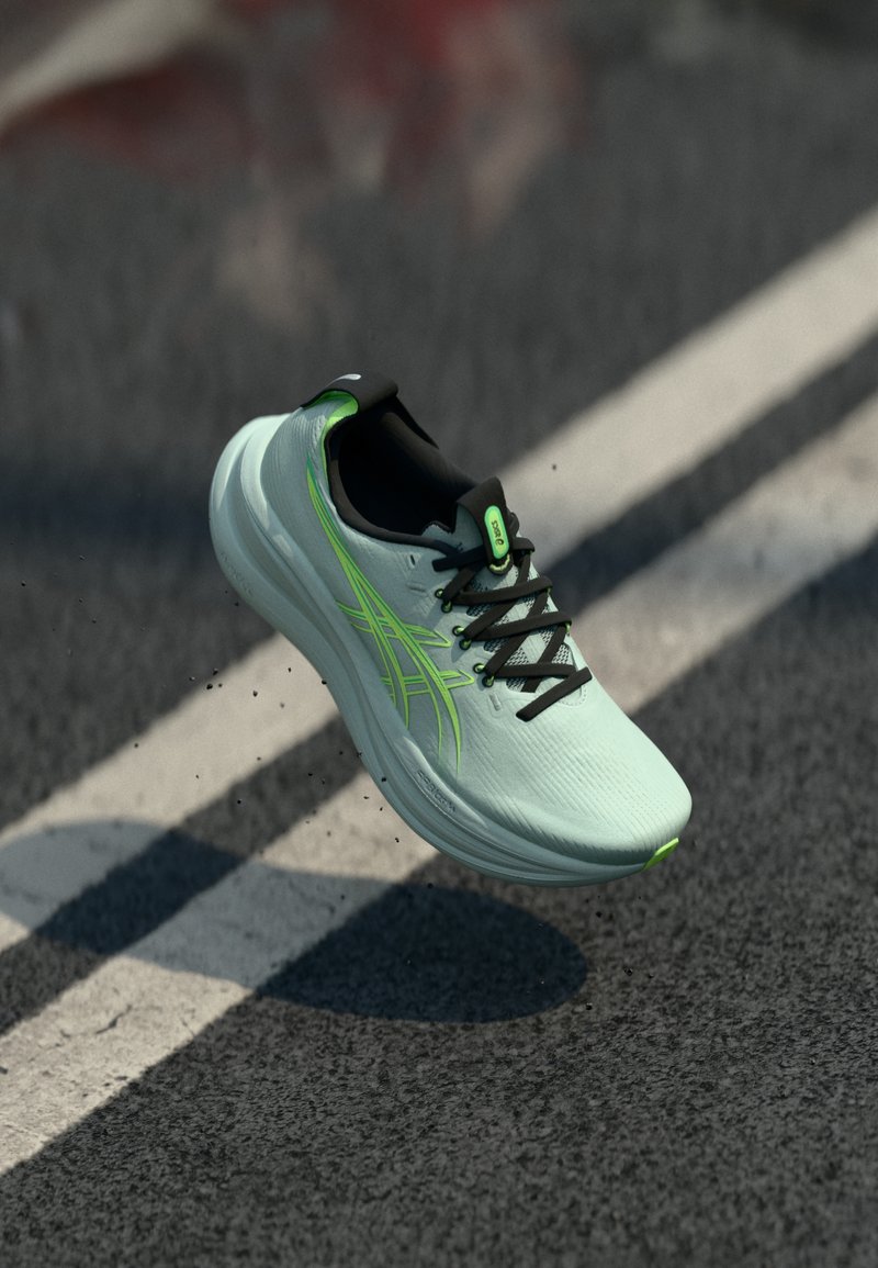 Scarpa da corsa verde acqua con accenti neri e dettagli verdi, caratterizzata da una tomaia testurizzata, design con lacci e suola ammortizzata.