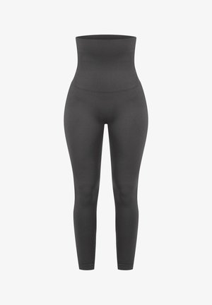 Leggings taille haute en noir uni. Fabriqués à partir d'un tissu lisse et extensible, avec un design sans couture et une silhouette ajustée.