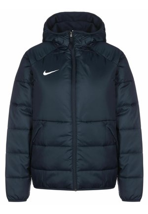 Marineblauwe pufferjack met een capuchon, voorzien van een volledige rits en twee zijzakken. Inclusief een wit Nike-logo op de borst.