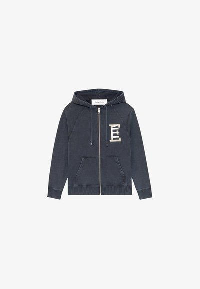 Hoodie zippé marine en tissu doux. Il dispose d'une poche kangourou, de manches raglan et d'un logo graphique blanc sur la poitrine.