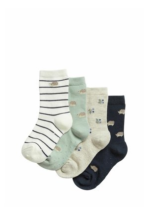 Vier Paar Knöchelsocken in Weiß mit schwarzen Streifen, Hellgrün, Beige und Dunkelblau, jeweils mit kleinen Tier- oder Blumenmustern.