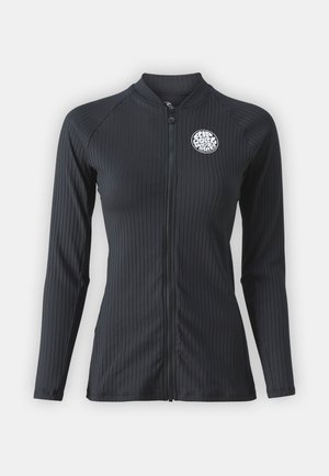 Rash guard noir à manches longues côtelé avec une fermeture éclair à l'avant. Présente un logo rond sur la poitrine. Le matériau semble extensible et élégant.