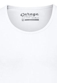 White cotton T-shirt with a round neckline, featuring a branded label in gray. Fabric has a smooth texture and regular fit design.