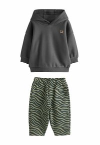 Dark gray hoodie with a V-neck and small orange logo, paired with green zebra-striped shorts featuring an elastic waistband.