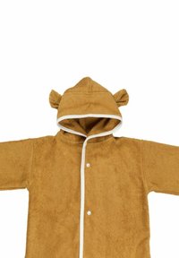 Brun huva jacka gjord av mjukt, plyschmaterial. Har björnöron på huvan och en vit kant längs öppningen och nederkanten.