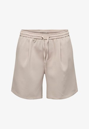 Shorts beiges décontractés avec taille élastique et cordon, présentant des plis latéraux et une texture de tissu lisse.