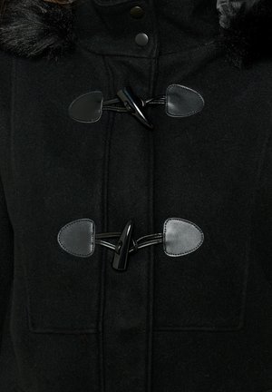 Black wool coat with a faux fur collar, featuring toggle closures and smooth leather accents. Textured fabric contributes to warmth.