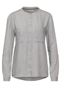 Camicia grigia a maniche lunghe realizzata in tessuto leggero. Presenta un collo rotondo, chiusura a bottoni e due tasche sul petto. Tessuto liscio.