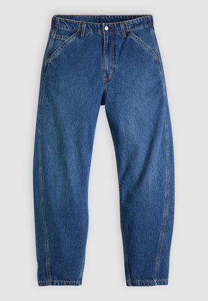 Sinine teksapükste lõdva lõikega, ees nööpidega sulguvad, viie taskuga ja kontrastse oranži õmblusega. Ühtlane sile tekstuur üle kogu pinna.