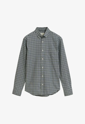 Modrá a bílá kostkovaná košile, dlouhé rukávy, límec na knoflíky a přední kapsa. Vyrobena z tkaniny s hladkou texturou.