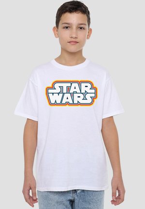 White cotton t-shirt featuring a bold, colorful "STAR WARS" logo across the chest. Loose fit with short sleeves and a crew neckline.