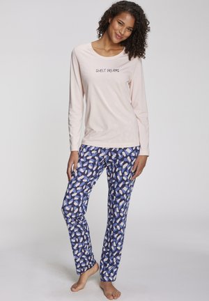 Light pink long-sleeve top with "Sweet Dreams" text. Blue pajama pants featuring a multicolored abstract pattern. Soft fabric, relaxed fit.