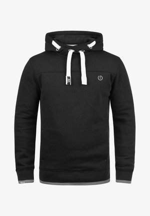 Must mustuga, valgete paeltega, esi-logo ja kontrastsete detailidega allservas ja varrukatel. Valmistatud pehmest, tekstuuriga kangast.