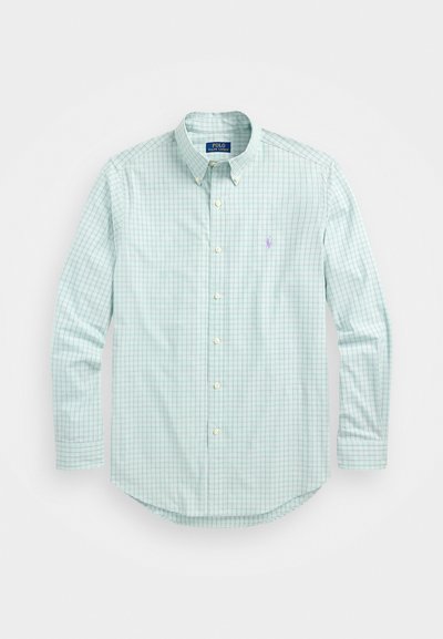 Heled roheline nööpidega särk, millel on tumeroheline ruudustik, klassikalise krae, pikad varrukad ja väike broderi logo.