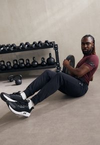 Champion ICON PANTS - Tepláky - black