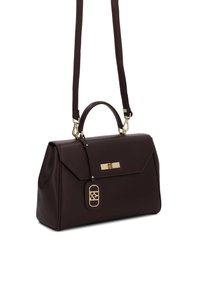 Czarna bordowa skórzana torebka o sztywnej formie, z złotymi elementami, górnym uchwytem i regulowanym paskiem. Posiada wskaźnik logo oraz małą metkę.