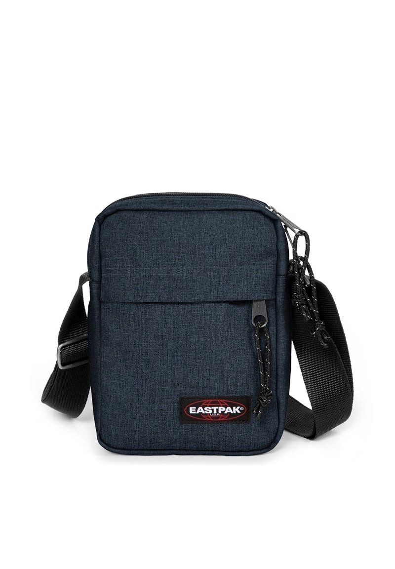 Compact dark blue crossbody bag with black adjustable strap, front zipper pocket, and Eastpak logo patch.