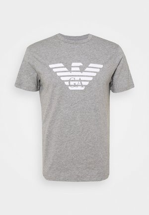 T-shirt en coton gris avec un col rond, des manches courtes, présentant un logo d'aigle rayé blanc et "GA" au centre.