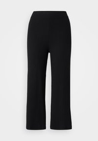 Pantalons en tricot côtelé noirs avec une coupe évasée et une taille élastique. Texture lisse et lignes continues, offrant un look minimaliste.