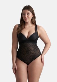 Body shaper nero con pannelli in pizzo, dotato di scollatura a V, spalline regolabili e motivi floreali sulle sezioni in rete.