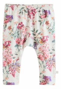 Virágmintás leggings fehér alapon; különféle színes virágokkal rózsaszín, lila és zöld árnyalatokban. Rugalmas derékbőség kialakítás.